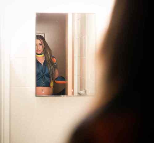 Melissa Tait / Winnipeg Free Press
Aurora checks herself out in the mirror in the Chalet Hotel room before going on stage for the Miss Nude Winnipeg Contest at Teasers.