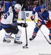 Frank Franklin II / The Associated Press
The Jets' Blake Wheeler (26) and the Rangers' Michael Del Zotto (4) vie for control of the puck during the first period of the game in New York on Tuesday.