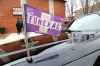 In Manitoba, many lead cars in the funeral procession are equipped with a flashing purple light and the other vehicles in the procession have flags on their windows. (Martha Irvine / The Associated Press Files)