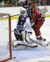 Rick Havner / The Associated Press
Jets goalie David Aebischer watches a shot by Carolina Hurricanes' Jussi Jokinen slide past the net Sunday.
