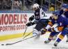 Kathy Willens / The Associated Press
Winnipeg Jets left-winger Kenndal McArdle (23) challenges New York Islanders defenceman Travis Hamonic (3) in the first period of their NHL hockey game at Nassau Coliseum in Uniondale, N.Y.