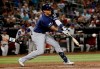 Milwaukee Brewers' Orlando Arcia connects for an RBI base hit against the Arizona Diamondbacks during the eighth inning of a baseball game Thursday, July 18, 2019, in Phoenix. (AP Photo/Matt York)
