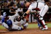 Los Angeles Dodgers' Russell Martin (55) is tagged out at the plate by Arizona Diamondbacks catcher Carson Kelly (18) on a base hit by Hyun-Jin Ryu during the fourth inning of a baseball game, Tuesday, June 4, 2019, in Phoenix. (AP Photo/Matt York)