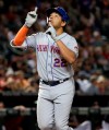 New York Mets' Dominic Smith celebrates his solo home run against the Arizona Diamondbacks during the seventh inning of a baseball game Saturday, June 1, 2019, in Phoenix. (AP Photo/Matt York)