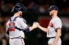Atlanta Braves pitcher Jonny Venters and catcher Brian McCann celebrate after defeating the Arizona Diamondbacks in a baseball game, Saturday, May 11, 2019, in Phoenix. (AP Photo/Rick Scuteri)