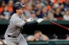 New York Yankees' Kyle Higashioka watches his three-run home run off Baltimore Orioles starting pitcher John Means during the fourth inning of a baseball game Wednesday, Aug. 7, 2019, in Baltimore. (AP Photo/Julio Cortez)