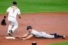 New York Yankees' Brett Gardner slides into second with a double during the third inning of a baseball game, next to Baltimore Orioles shortstop Richie Martin on Wednesday, May 22, 2019, in Baltimore. (AP Photo/Nick Wass)