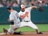 New York Yankees' Brett Gardner (11) slides into second as Baltimore Orioles shortstop Richie Martin (1) tries to catch the throw from the outfield on a double by Gardner during the ninth inning of a baseball game, Wednesday, Aug. 7, 2019, in Baltimore. The Yankees won 14-2. (AP Photo/Julio Cortez)