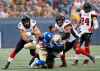 THE CANADIAN PRESS
Winnipeg Blue Bombers Kenbrell Thompkins gets hauled down by Ottawa Redblacks' Avery Williams during the first half of CFL action in Winnipeg Friday, August 17, 2018.