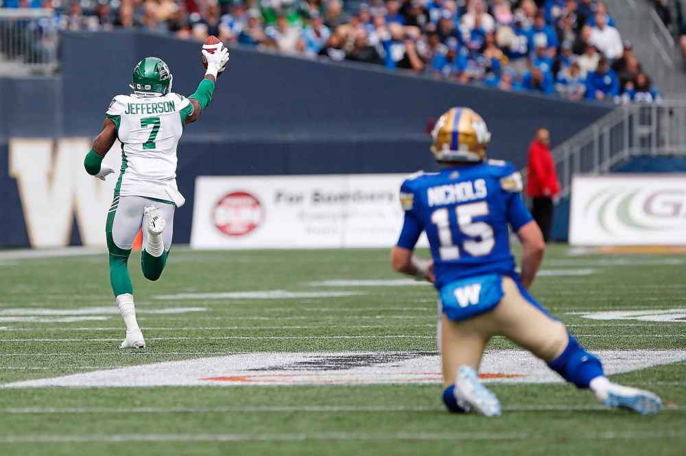 CP
Winnipeg Blue Bombers quarterback Matt Nichols (15) looks on as Saskatchewan Roughriders' Willie Jefferson (7) runs for the touchdown after intercepting Nichols' pass during first half CFL action in the 15th annual Banjo Bowl in Winnipeg Saturday, September 8, 2018. THE CANADIAN PRESS/John Woods