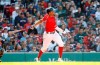 Boston Red Sox's Xander Bogaerts follows through on his RBI-double against the Houston Astros during the seventh inning of a baseball game Sunday, May 19, 2019, at Fenway Park in Boston. (AP Photo/Winslow Townson)