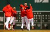 Boston Red Sox's Michael Chavis, second from right, is mobbed by teammates after his game-ending RBI single during the 10th inning of a baseball game against the Colorado Rockies on Wednesday, May 15, 2019, at Fenway Park in Boston. The Red Sox won 6-5.(AP Photo/Winslow Townson)