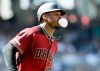 Arizona Diamondbacks' Adam Jones blows a bubble on his way to first base after hitting a two-run home run against the San Diego Padres during the second inning of a baseball game in San Diego, Sunday, Sept. 22, 2019. (AP Photo/Alex Gallardo)
