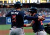 Atlanta Braves' Josh Donaldson, right, is greeted by teammate Freddie Freeman (5) after hitting a three-run home run during the first inning of a baseball game against the San Diego Padres, Friday, July 12, 2019, in San Diego. (AP Photo/Gregory Bull)