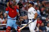 San Diego Padres' Francisco Mejia, right, reacts after getting hit by a pitch as St. Louis Cardinals catcher Yadier Molina, left, watches during the second inning of a baseball game Saturday, June 29, 2019, in San Diego. (AP Photo/Gregory Bull)