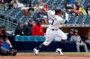 San Diego Padres' Manny Machado follows through on a single during the sixth inning of the team's baseball game against the Arizona Diamondbacks, Wednesday, May 22, 2019, in San Diego. (AP Photo/Gregory Bull)