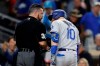 Los Angeles Dodgers' Justin Turner, right, argues with home plate umpire Rob Drake after striking out to end the baseball game against the San Diego Padres, Monday, Aug. 26, 2019, in San Diego. The Padres won 4-3. (AP Photo/Gregory Bull)