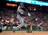 Arizona Diamondbacks' Adam Jones hits an RBI single against the San Francisco Giants during the sixth inning of a baseball game in San Francisco, Tuesday, Aug. 27, 2019. (AP Photo/Tony Avelar)