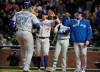 Toronto Blue Jays' Eric Sogard, center, and Trent Thornton, right, wait at home plate for Vladimir Guerrero Jr. (27) after he hit a three-run home run against the San Francisco Giants during the sixth inning of a baseball game in San Francisco, Tuesday, May 14, 2019. (AP Photo/Tony Avelar)