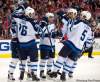 Chuck Myers / Tribune Media / MCT
Winnipeg Jets' left-winger Andrew Ladd (16) celebrates with teammates following his goal against the Washington Capitals in the first period Wednesday.