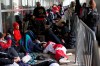 Toronto Raptors fans line up outside the Scotiabank Arena, in Toronto on Monday, June 10, 2019, to gain access to the fan area known as 'Jurassic Park' ahead of game five of the NBA Finals between the Toronto Raptors ad Golden State Warriors. THE CANADIAN PRESS/Chris Young