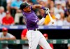 Colorado Rockies' Ian Desmond struggles to check his swing while facing Cincinnati Reds starting pitcher Sonny Gray during the second inning of a baseball game Friday, July 12, 2019, in Denver. (AP Photo/David Zalubowski)