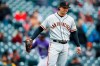 San Francisco Giants starting pitcher Derek Holland calls for a new ball after giving up a two-run home run to Colorado Rockies' Ian Desmond in the second inning of a baseball game Thursday, May 9, 2019, in Denver. (AP Photo/David Zalubowski)