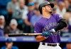 Colorado Rockies' Nolan Arenado reacts to a high, inside pitch from Chicago Cubs starting pitcher Jose Quintana in the first inning of a baseball game Tuesday, June 11, 2019, in Denver. (AP Photo/David Zalubowski)