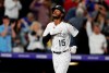 Colorado Rockies pinch hitter Raimel Tapia gestures as he circles the bases after hitting a grand slam off Milwaukee Brewers relief pitcher Jay Jackson in the sixth inning of a baseball game Friday, Sept. 27, 2019, in Denver. (AP Photo/David Zalubowski)