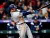 San Diego Padres' Ty France watches his RBI single off Colorado Rockies starting pitcher German Marquez during the fifth inning of a baseball game Friday, May 10, 2019, in Denver. (AP Photo/David Zalubowski)