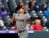 Arizona Diamondbacks' Eduardo Escobar celebrates as he circles the bases after hitting a solo home run off Colorado Rockies starting pitcher Antonio Senzatela in the third inning of a baseball game Tuesday, May 28, 2019, in Denver. (AP Photo/David Zalubowski)