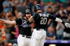 Colorado Rockies' Ian Desmond, right, celebrates his two-run home run with Daniel Murphy during the ninth inning of the team's baseball game against the San Francisco Giants on Tuesday, July 16, 2019, in Denver. (AP Photo/David Zalubowski)