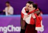 Tessa Virtue and Scott Moir of Canada celebrate during the venue ceremony after winning the gold medal in the ice dance, free dance figure skating final in the Gangneung Ice Arena at the 2018 Winter Olympics in Gangneung, South Korea, Tuesday, Feb. 20, 2018. Canadian ice dancing stars Tessa Virtue and Scott Moir say they are 