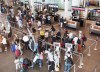 Passengers wait to check in at Trudeau Airport in Montreal on July 19, 2017. Air passengers who are bumped from their flights because of overbooking, or forced to sit through long days will be able to receive up to $2,400 under proposed federal rules. THE CANADIAN PRESS/Ryan Remiorz