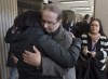 Glen Assoun is embraced by family members at Nova Scotia Supreme Court in Halifax on March 1, 2019. Glen Assoun's lawyer says the wrongfully convicted Halifax man suffered 