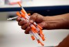 Used needles are shown at a needle exchange in Miami, May 6, 2019. Barring drug-using federal prisoners from access to clean syringes puts them at risk for serious diseases and violates their rights, an Ontario court is set to hear. THE CANADIAN PRESS/AP/Lynne Sladky