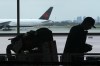 A passenger waits beside their luggage at the departure terminal at Toronto Pearson Airport, in Mississauga, Ont., Friday, May 24, 2019. Starting today, airline passengers can receive up to $2,400 if they'e bumped from a flight, part of a slew of air traveller protections beefing up compensation for travellers subjected to delayed flights and damaged luggage. THE CANADIAN PRESS/Chris Young