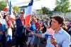 Prime Minister Justin Trudeau points to Conservative Leader Andrew Scheer while walking with the crowd during the Tintamarre in celebration of the National Acadian Day and World Acadian Congress in Dieppe, N.B., on Aug. 15, 2019. Conservative Leader Andrew Scheer is asking Liberal MPs on the House of Commons ethics committee to vote to continue the investigation into the SNC-Lavalin affair, after a scathing report found that the prime minister broke ethics law. THE CANADIAN PRESS/Marc Grandmaison