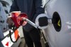 A man fills up his truck with gas in Toronto, on Monday April 1, 2019. The Ontario government's latest salvo against the federal carbon tax is being mocked online for appearing to accidentally promote the very cause it hoped to attack. THE CANADIAN PRESS/Christopher Katsarov