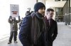 Relatives looking to collect on an American lawsuit against Omar Khadr are asking a Canadian court to force the former Guantanamo Bay prisoner to answer questions about his confession to purported war crimes. Former Guantanamo Bay prisoner Omar Khadr and his lawyer Nate Whitling walk into the courthouse after speaking with media in Edmonton on Tuesday, February 26, 2019. THE CANADIAN PRESS/Jason Franson