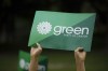 A supporter holds a sign for the Green Party of Canada as a group of candidates and supporters marched towards a discussion on climate with Green Party leader Elizabeth May in Toronto, Tuesday, Sept. 3, 2019. The Green party says it recently learned of Islamophobic social-media posts by four of its Quebec candidates. The party says the candidates will make a public statement of apology and commit to learning more about Islam by working with the National Council of Canadian Muslims. THE CANADIAN PRESS/Cole Burston