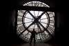 A visitor looks through the clock of the Orsay museum, overlooking Paris, Thursday, Oct. 16, 2014. British Columbia has introduced legislation that would eliminate the need to change the clocks twice a year with the creation of Pacific time. Attorney General David Eby says the Interpretation Amendment Act, if passed, would make daylight saving time permanent. THE CANADIAN PRESS/AP, Michel Euler