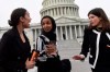 Rep. Alexandria Ocasio-Cortez, D-N.Y., left, talks with Rep. Ilhan Omar, D-Minn., center, and Rep. Haley Stevens, D-Mich., right, as they head to a group photo with the women of the 116th Congress on Capitol Hill in Washington, Friday, Jan. 4, 2019. Americans elected 36 new female faces in last year's midterm elections - most of them Democrats in the House of Representatives - in what proved to be the most ethnically diverse and women-centric freshman class in the history of Congress, which now boasts the most women members in its history, including the first Muslim and Indigenous women ever elected to sit in the chamber.THE CANADIAN PRESS/AP/Susan Walsh