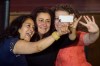 NDP candidate for the riding of Honore-Mercier Paulina Ayala, left, Maria Mourani, centre, candidate for the riding of Ahuntsic, and candidate for the riding of Saint-Leonard - Saint-Michel Rosannie Filato, right, take a selfie at an event in Montreal on September 3, 2015. THE CANADIAN PRESS/Dario Ayala