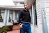 Omar Khadr walks out the front door of his lawyer Dennis Edney's home to speak the media in Edmonton, Thursday, May 7, 2015. Former Guantanamo Bay detainee Omar Khadr is back in court today to seek changes to bail conditions imposed while he appeals war crime convictions by a U.S. military commission. THE CANADIAN PRESS/Nathan Denette