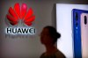 A shopper walks past a Huawei store at a shopping mall in Beijing Wednesday, July 4, 2018. The Justice Department says the chief financial officer of China's Huawei Technologies, who is sought for extradition by the United States, has been arrested in Vancouver. THE CANADIAN PRESS/AP-Mark Schiefelbein