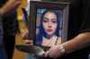 CP
Delores Daniels holds a photo of her daughter Serena McKay who was murdered three months ago in Sagkeeng during a press conference calling for a re-organization of the National Inquiry into Missing and Murdered Indigenous Women and Girls (MMIWG) in Winnipeg, Wednesday, July 12, 2017. A teenager who helped attack a young Manitoba woman and shared the footage of her bloody death has been sentenced to just over three years in jail. THE CANADIAN PRESS/John Woods