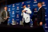Chicago Cubs' President of Baseball Operations Theo Epstein, left, looks on after introducing new team manager David Ross, center, as General Manager Jed Hoyer looks on during a press conference on Monday, Oct. 28, 2019, in Chicago. (AP Photo/Matt Marton)