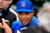 Chicago Cubs shortstop Addison Russell speaks to the media in the dugout before a baseball game against the Miami Marlins, Wednesday, May 8, 2019, in Chicago. Russell rejoins the team after completing a 40-game suspension for violating Major League Baseball's domestic violence policy and spending extra time in the minors to get ready. (AP Photo/Paul Beaty)