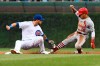 Chicago Cubs right fielder Ben Zobrist, left, tags out St. Louis Cardinals' Kolten Wong (16) at second base on an attempted steal during the first inning of a baseball game Thursday, Sept. 19, 2019, in Chicago. (AP Photo/Matt Marton)